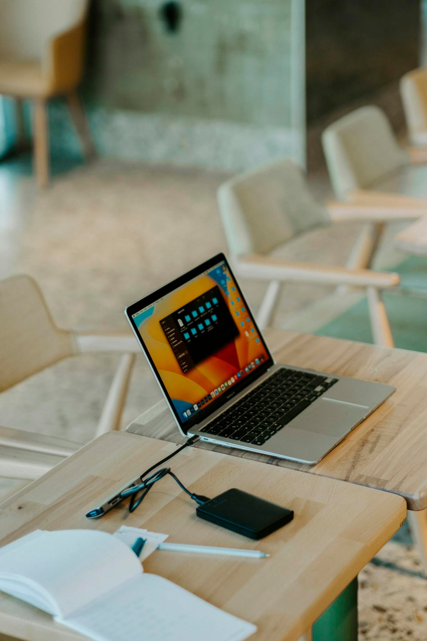 A Sleek Laptop With Accessories On A